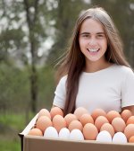 girl with a box full of eggs.jpg