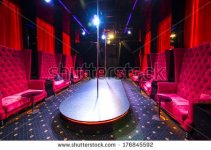 stock-photo-interior-strip-club-with-sofas-and-tables-poles-176845592.jpg